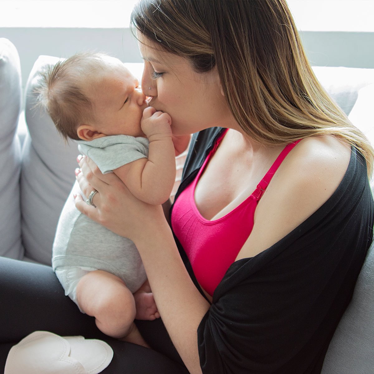 Mom in the nursing shawl holding their baby and kissing their nose | Bamboobies