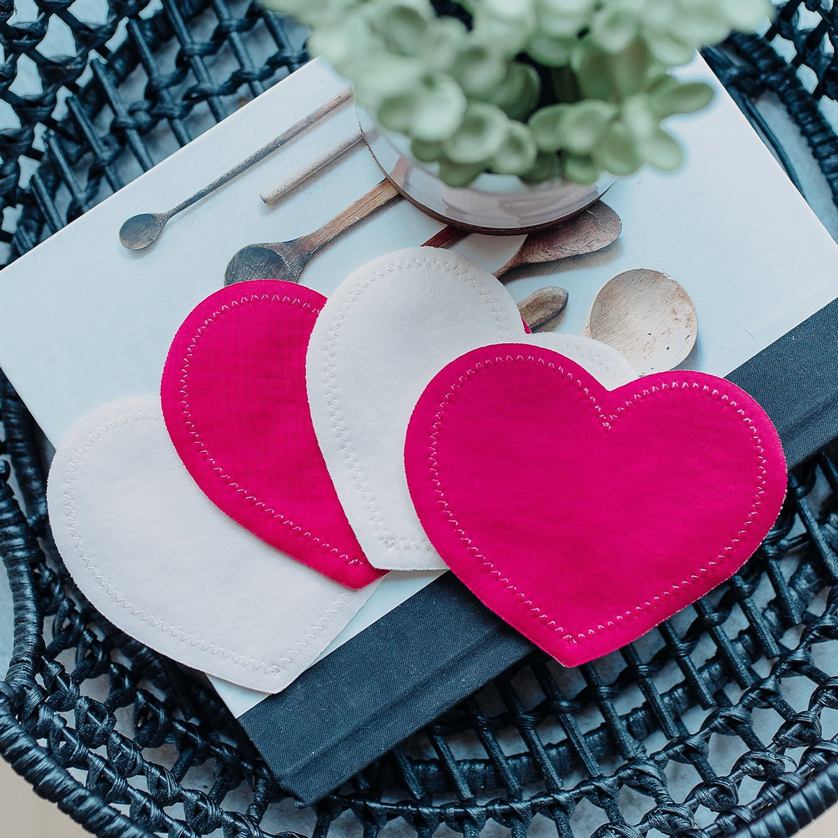 Bright pink washable nursing pads on the table | Bamboobies