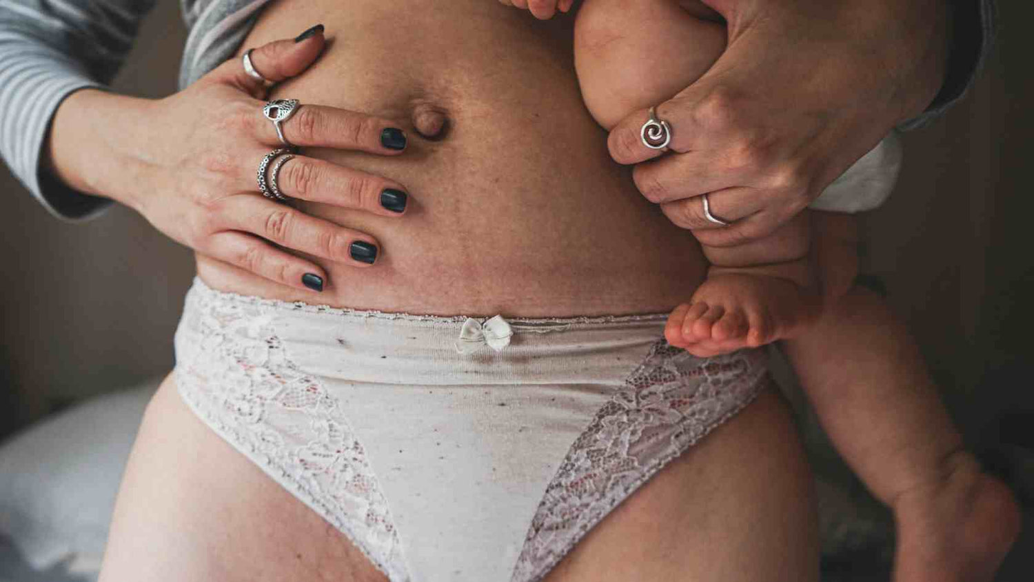 mom holding baby after birth | bamboobies